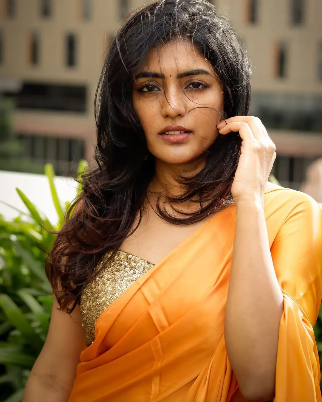 Eesha Rebba Charming Stills In Orange Saree Sleeveless Blouse